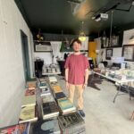 Andy selling books, CDs and vintage items at The Cut-Off, Ripley Main Street says Photos from Ripley Main Street's post