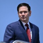 Rubio's Nike tracksuit on Air Force One sparks memes during China trip Marco Rubio spotted in Nike tracksuit aboard Air Force One during trip to China, igniting memes onli