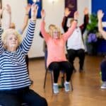 Bolivar Senior Center Awarded $50,000 State Grant Senior adults taking part in a chair exercise class, illustrating programs funded by the Bolivar Senior Center grant