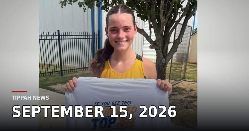 Ripley senior Jenna-Lynne Massengill smiles while holding a cross-country top-20 finisher T-shirt outside in Tippah County.