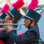Mississippi News Report — Saturday, Sep 26: Vicksburg Shooting Marching band trumpet players in plumed hats performing ahead of the Crossroads Marching Classic at Corinth High School's Warrior Stadium