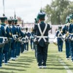 Ripley Band Named Reserve Grand Champion at Crossroads Classic Uniformed marching band lined up on a football field, illustrating the Ripley band's Reserve Grand Champion finish