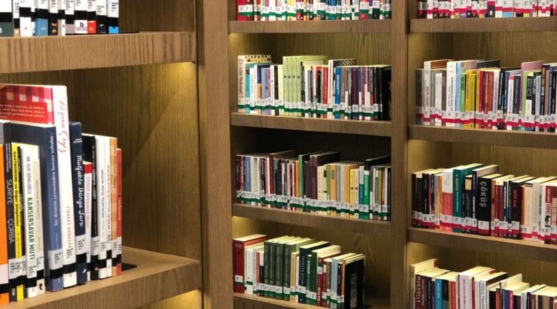 Organized library shelves filled with books, illustrating the Ripley Public Library clerk job opening