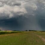 Tippah County Rain Forecast Brings Drought Relief Hope Dark rain clouds gather over farmland, representing the Tippah County rain forecast for the weekend