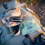 The 5 Best Emergency Preparedness Kits for Tippah County Families Khaki backpack with a survival kit laid out on the ground — emergency go-bag essentials