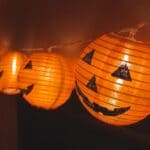The 5 Best Halloween Lights for Tippah County Homes A string of jack-o'-lantern lights hanging beside a wall