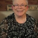 BMCU Dorm Mother Sandra Clark Honored as 'Big Mama' Portrait of BMCU dorm mother Sandra Clark smiling in a black floral blouse