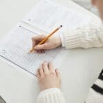 Bolivar Central Student Invited to Honor Society NSHSS Student filling in a multiple-choice answer sheet, illustrating a Bolivar Central student honor society invitation