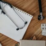Dr. June Powell, Benton County Medical Pioneer, Remembered Stethoscope and notebook on a wooden desk, illustrating the medical career of Dr. June Powell