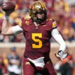 Gophers lineman kicks quarterback in groin during celebration at Huntington Bank Stadium; Minnesota upsets Michigan 20-14 Minnesota quarterback gets kicked in the crotch by teammate en route to upset win over Michigan