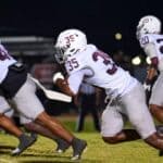 Mississippi News Report — Friday, Oct 16: Prison Healthcare, UMMC, Sports Coahoma Community College football players in white uniforms rushing during their road win over Mississippi Delta