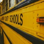 Hardeman County School Board Adds Nurse, Eyes Diesel Costs Close-up of a yellow county schools bus, illustrating Hardeman County school board fuel costs