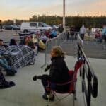 Mississippi News Report — Monday, Oct 26: Trump Rally, Fire Danger Supporters in lawn chairs wrapped in blankets wait behind barricades outside the Crossroads Arena in Corinth before sunrise ahead of the Trump rally