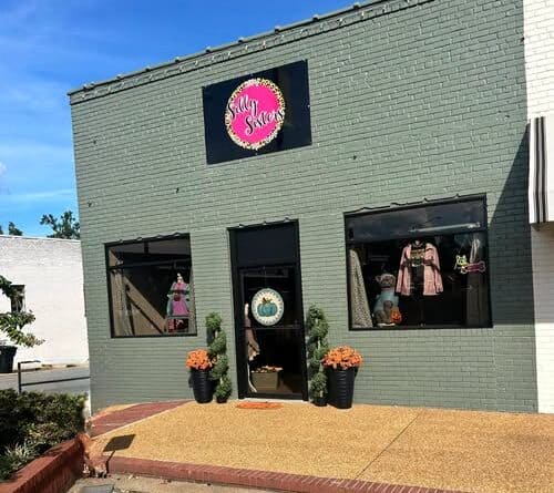 Silly Sisters Ripley storefront with a pink sign, fall mums and clothing displays on the Ripley square