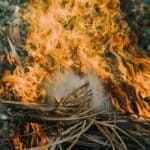 Tennessee Burn Permits Required Oct. 15 in Middleton, Hardeman Flames burning a pile of dry leaves and brush outdoors, illustrating Tennessee burn permits