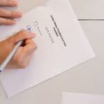 Tennessee Constitutional Amendments: What Middleton Voters Decide A voter marks a paper ballot, illustrating the Tennessee constitutional amendments on the 2026 ballot