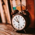 Time Change in Tippah County: Clocks Fall Back Nov. 1 Vintage alarm clock on a wooden bookshelf, a reminder of the time change in Tippah County