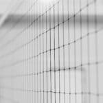Walnut Volleyball Falls to East Union in North State Final Close-up of an indoor volleyball net, illustrating Walnut volleyball's North State final